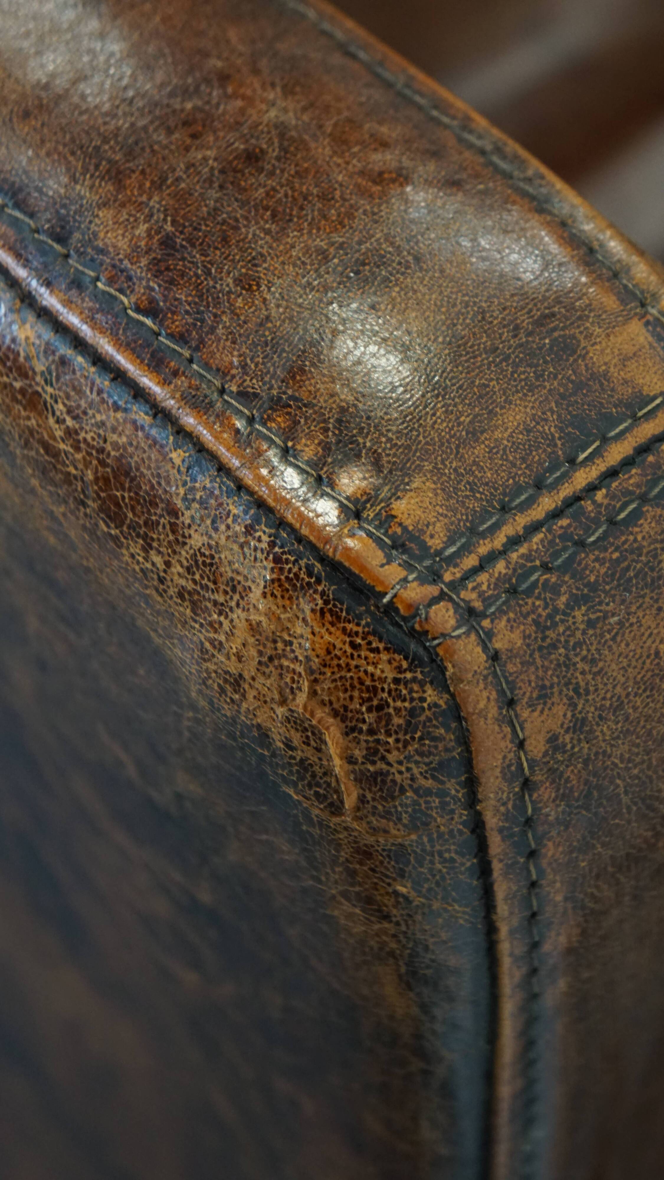 Dark brown design armchair made of sheepskin leather