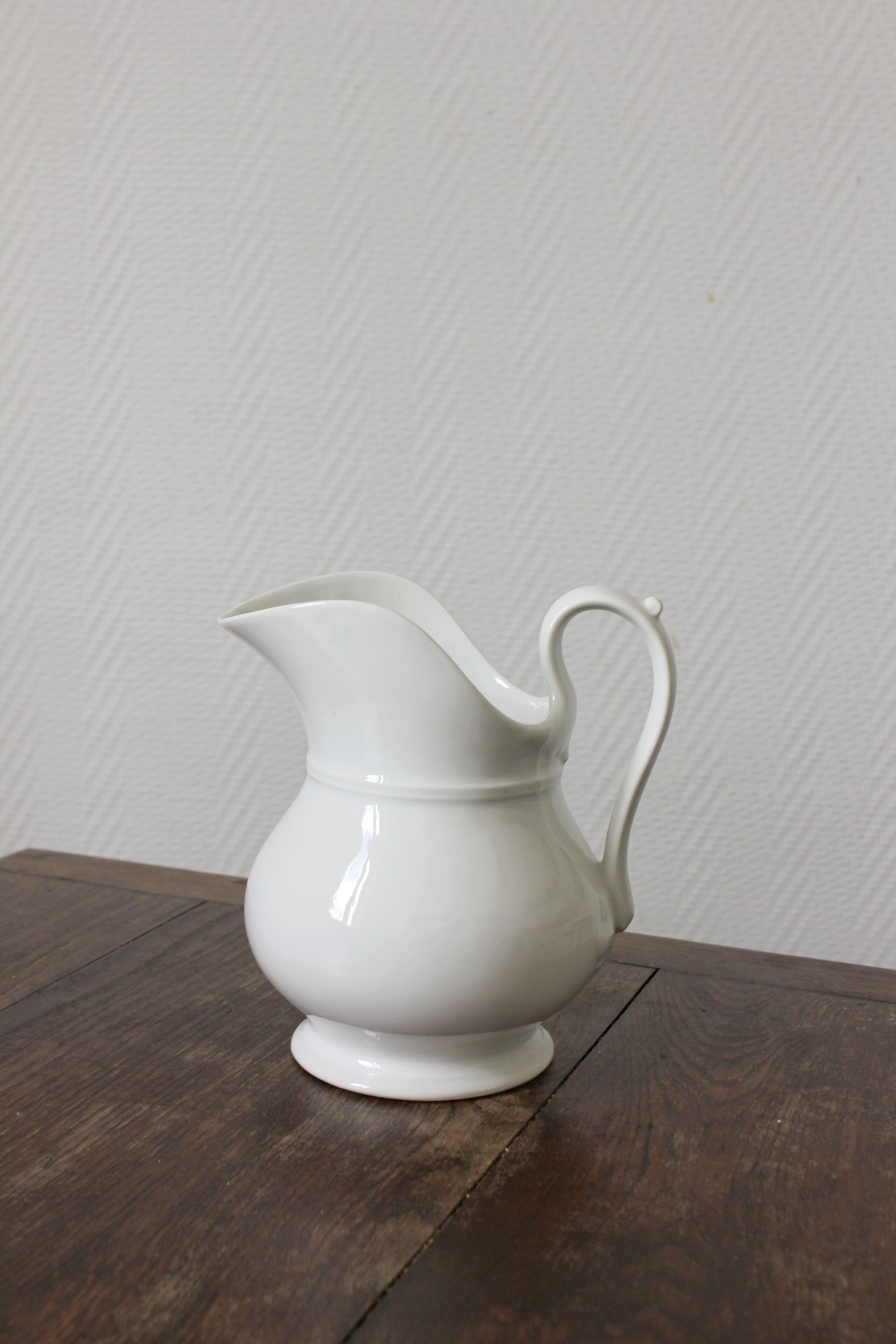 Antique white porcelain jug from the 19th century