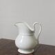 Antique white porcelain jug from the 19th century