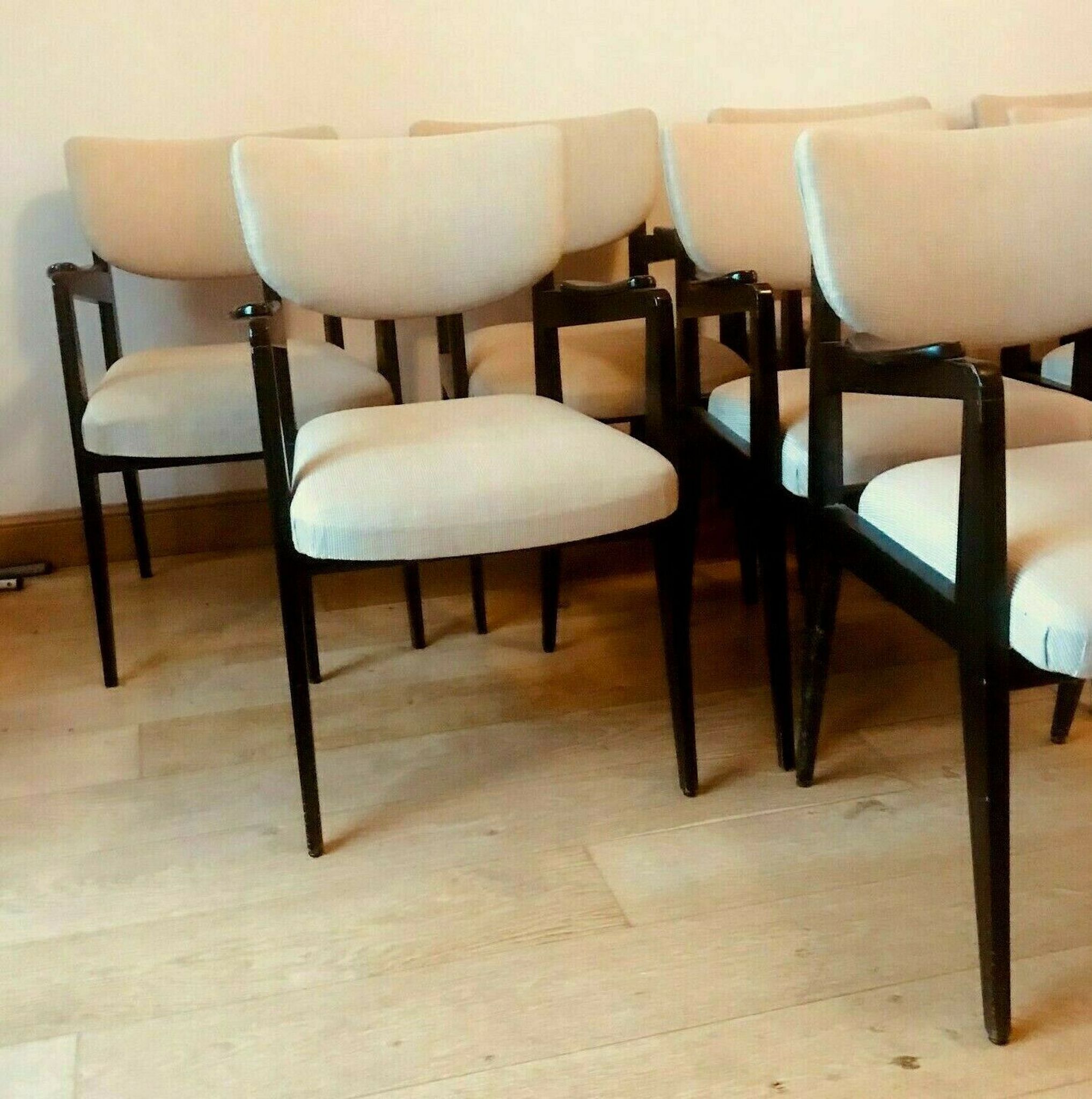 Suite of eight design chairs from the 60s in 10th century blackened wood