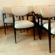 Suite of eight design chairs from the 60s in 10th century blackened wood