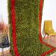Handmade pure wool rug in green and red, size 140/260 cm.