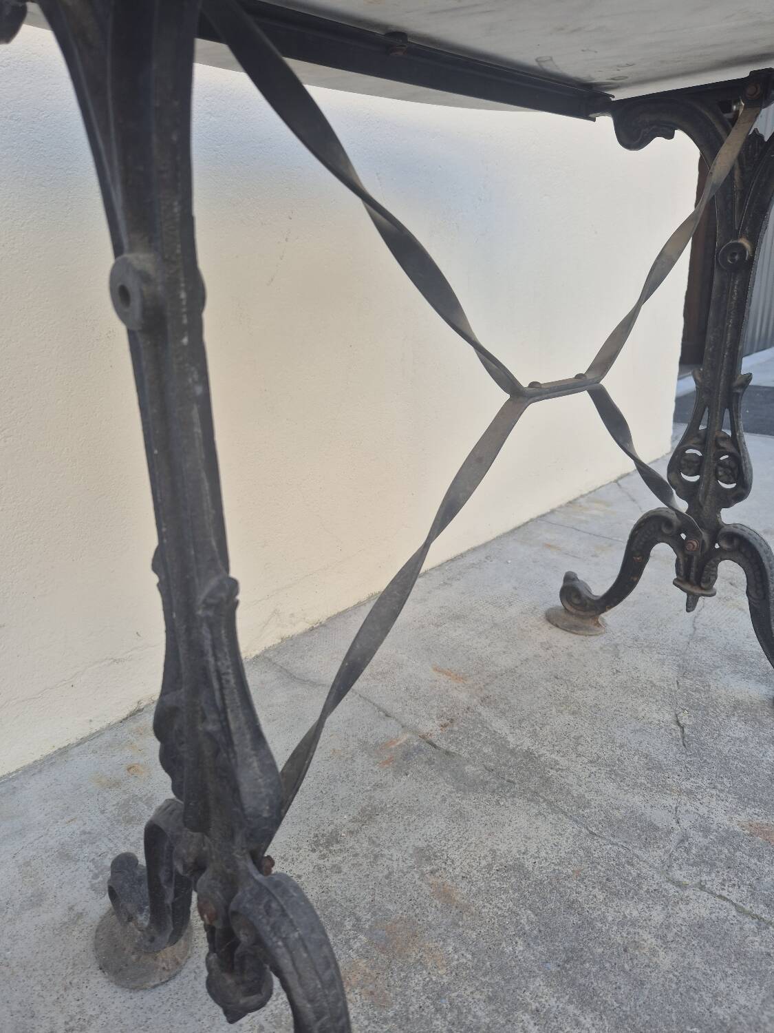 Antique cast iron and marble bistro restaurant table