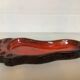 Red ceramic footprint catchall.