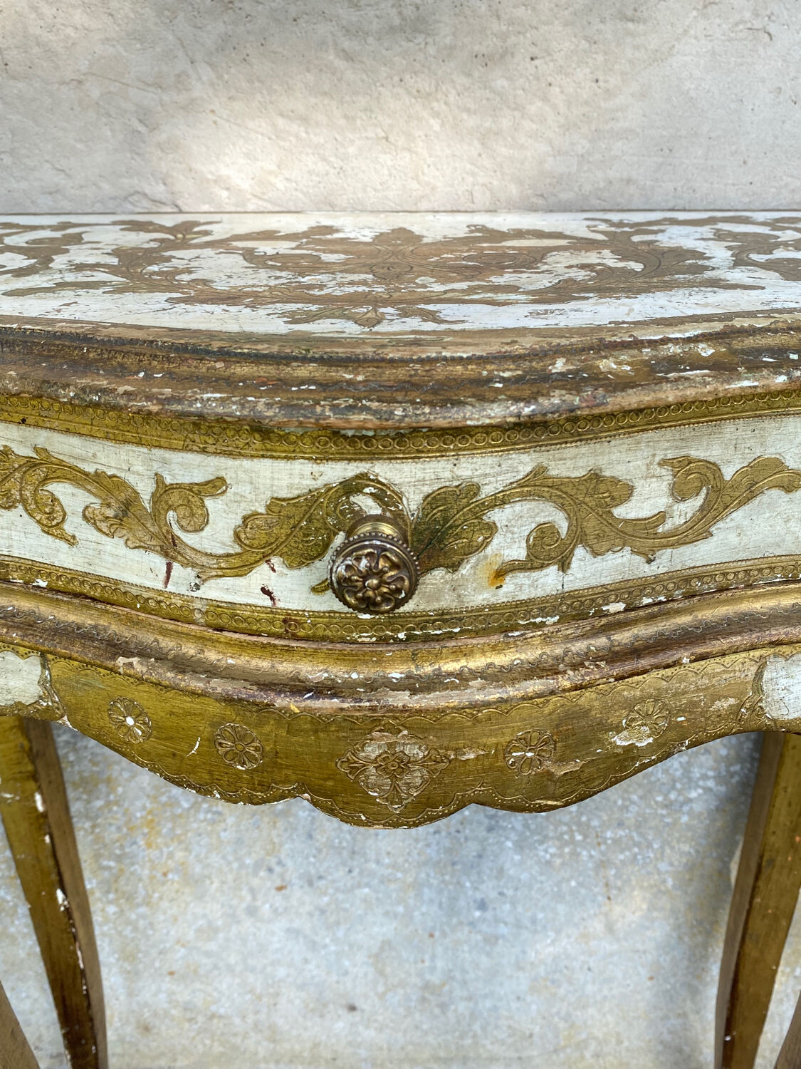 Pairs of Florentine bedside tables in gilded wood.