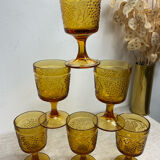 Six stemmed glasses in amber-colored molded glass