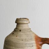 Old rustic stoneware bottle with handle