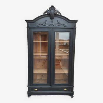 Bookcase black patina shell pediment 2 drawer doors