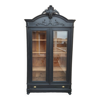 Bookcase black patina shell pediment 2 drawer doors