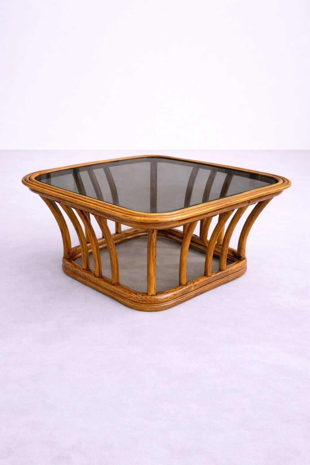 Rattan and smoked glass coffee table, vintage 1970s design.