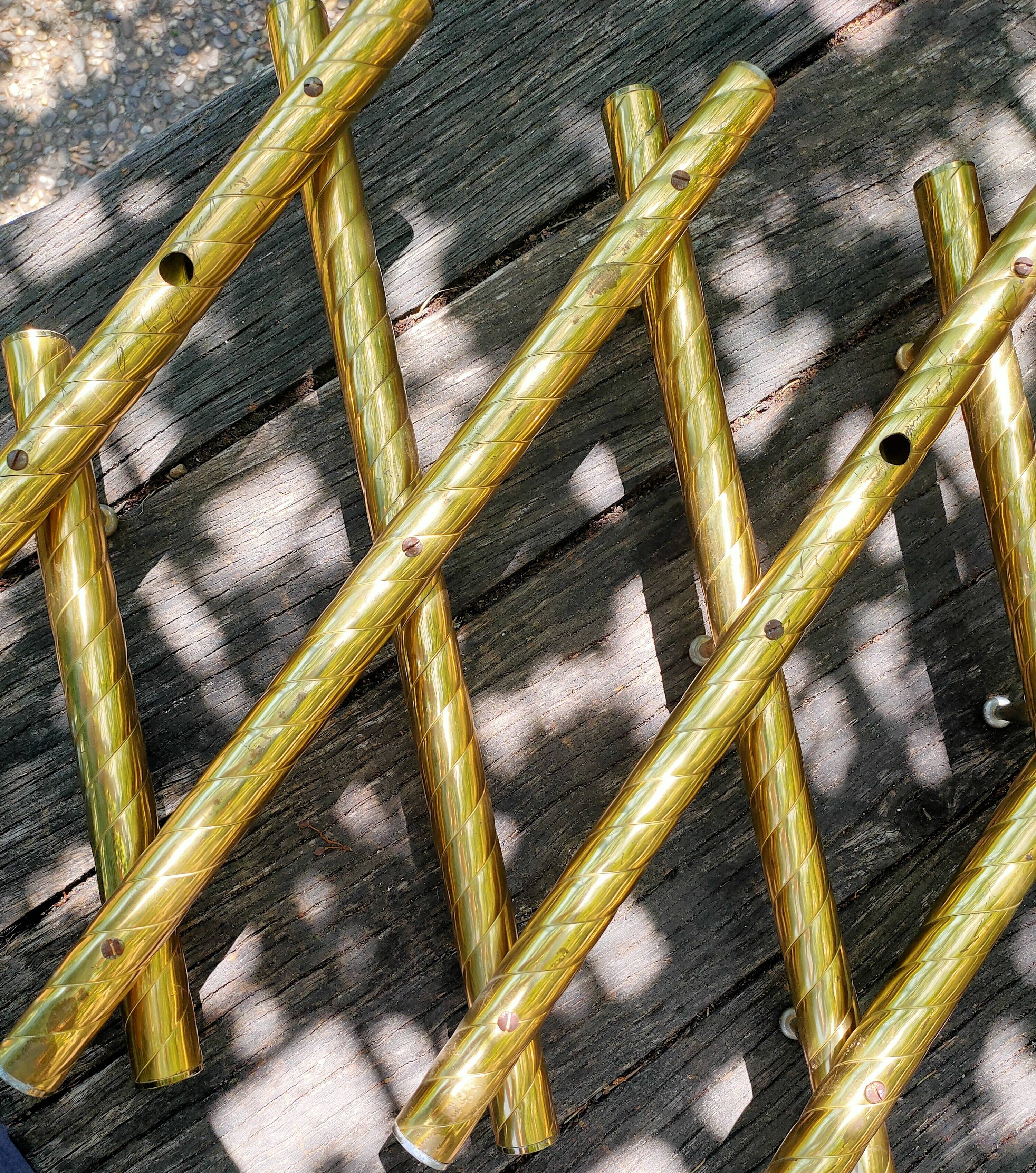 Wall coat rack in gilded metal