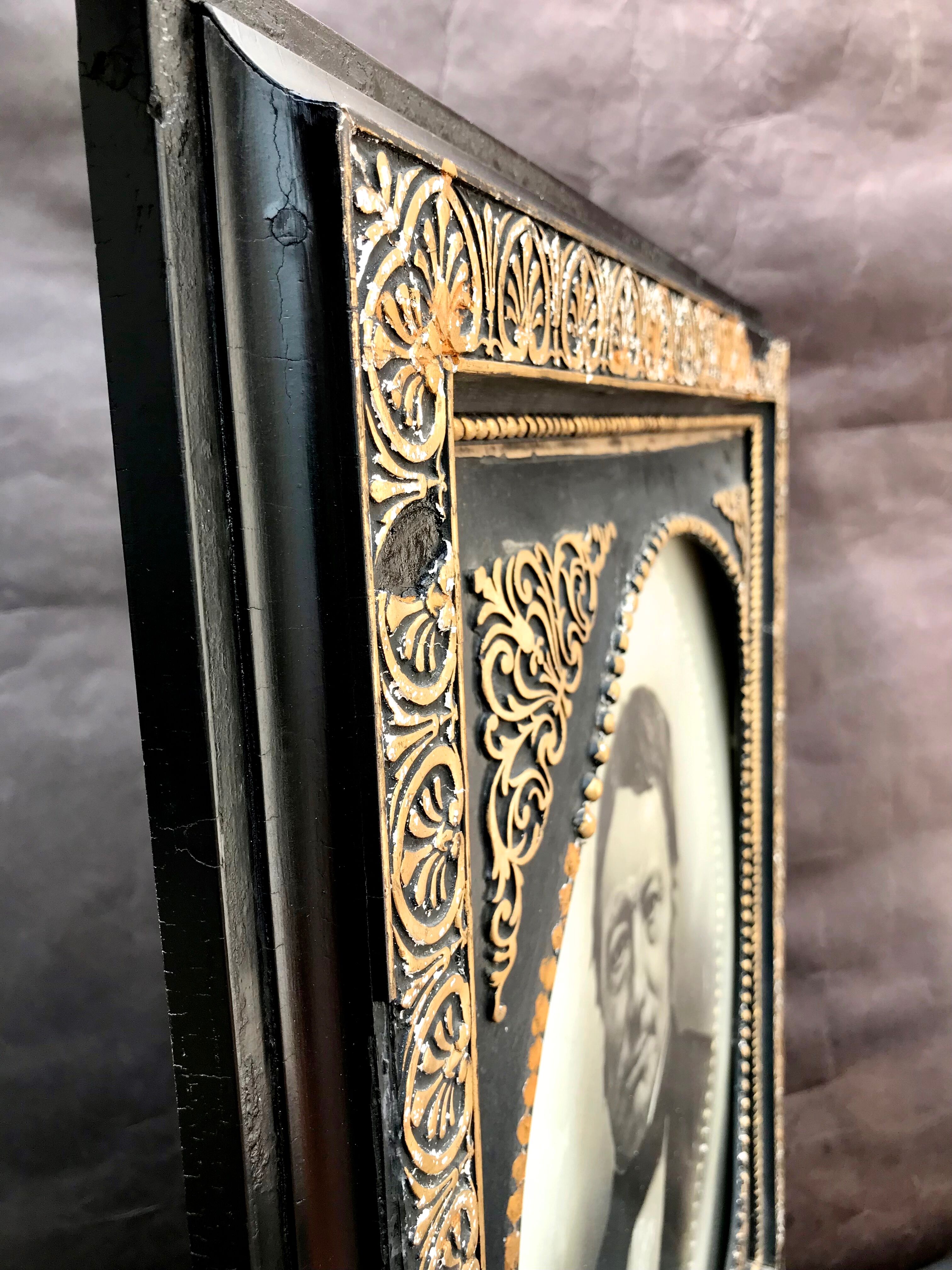 Black and gilded ebonite frame, wood and plaster 19th century