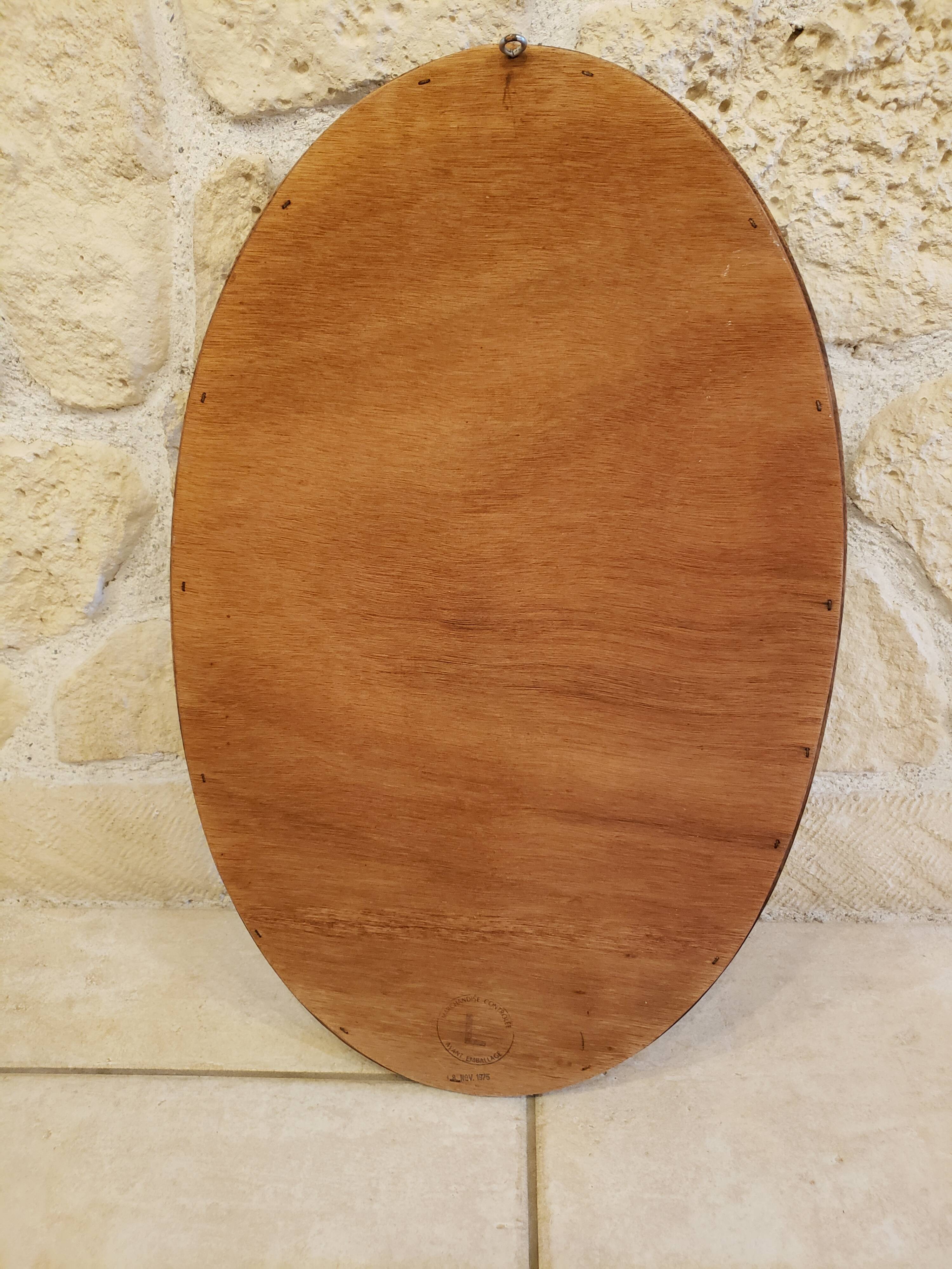 Oval vintage wooden mirror