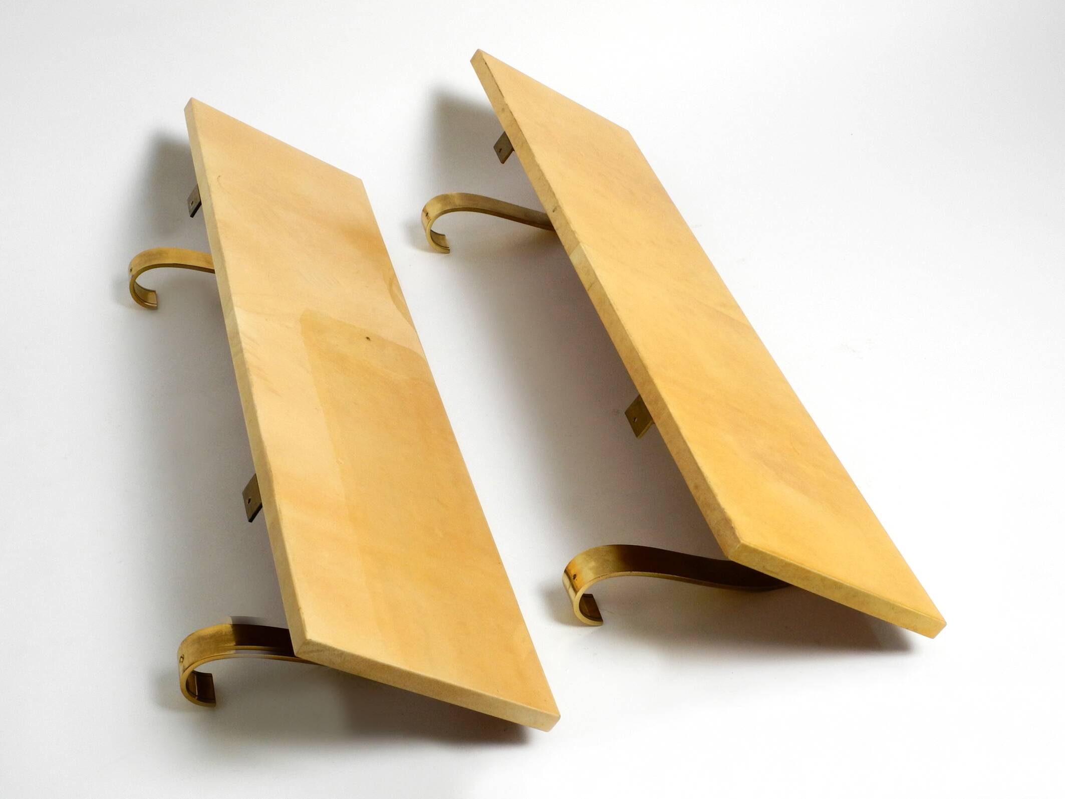 Two 1960s large Aldo Tura shelves made of wood and goatskin in beige