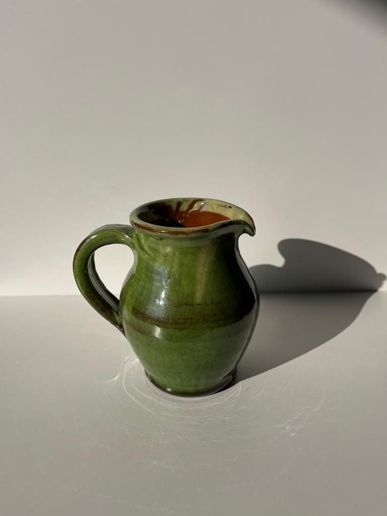 Green glazed ceramic pitcher