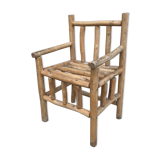 Art-Populaire armchair in raw wood, circa 1950.