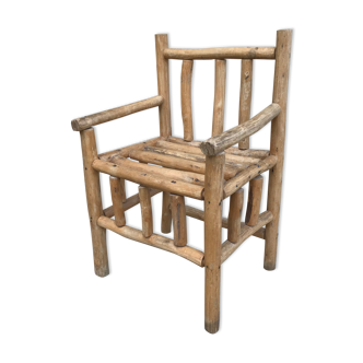 Art-Populaire armchair in raw wood, circa 1950.