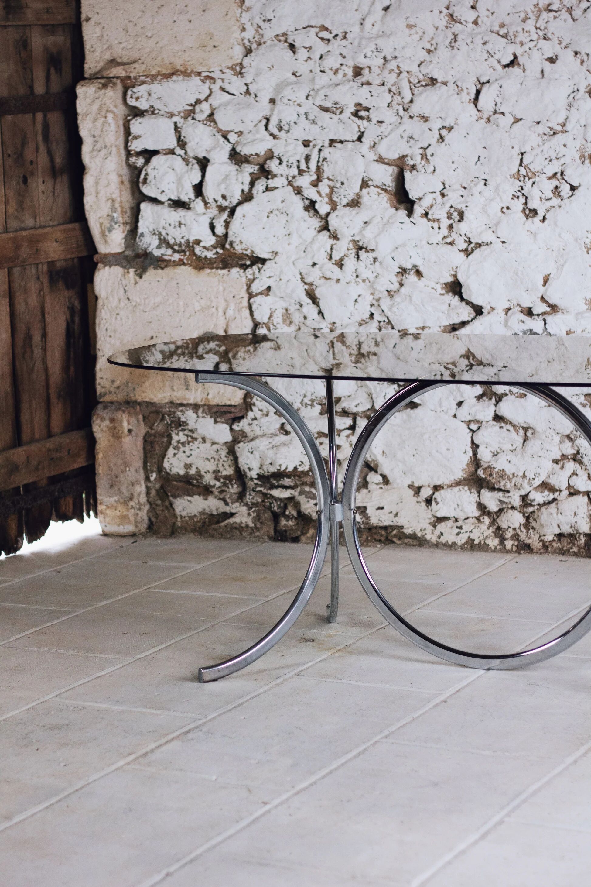 Chrome and smoked glass dining table in the style of Gastone Rinaldi, 1970.