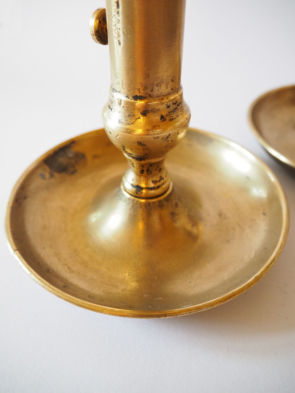 Set of three old brass candle holders