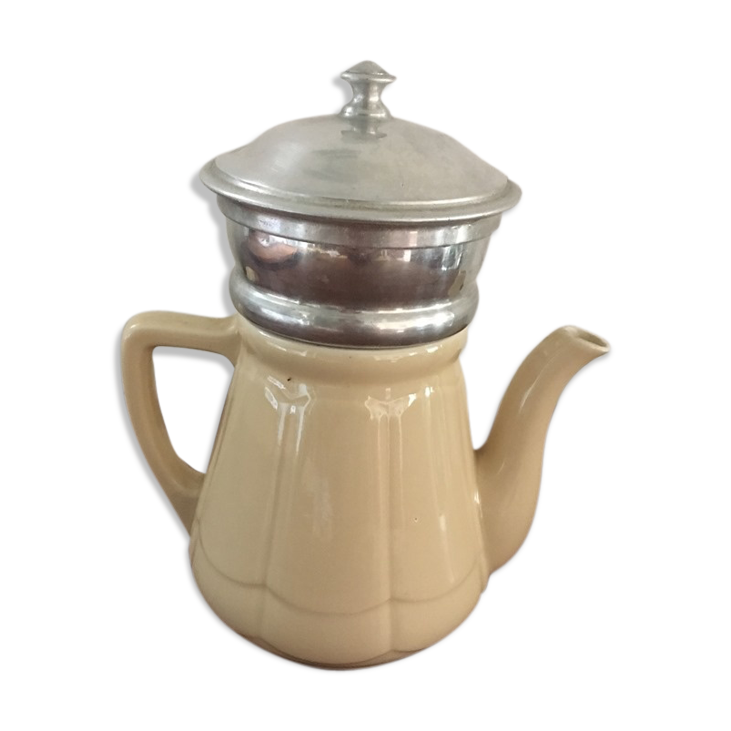Old tea pot or coffee maker in faience cream with filter.
