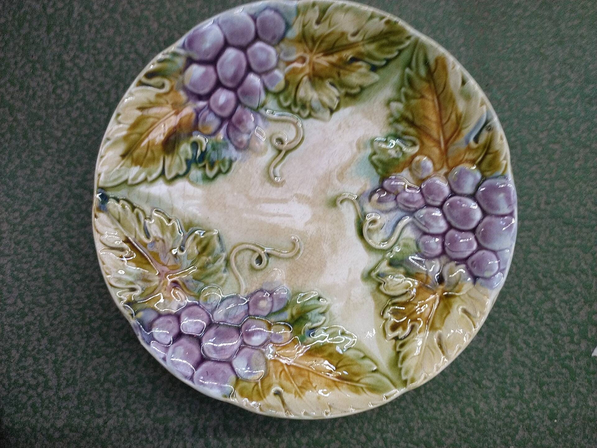 Slipware plates with vine decoration.