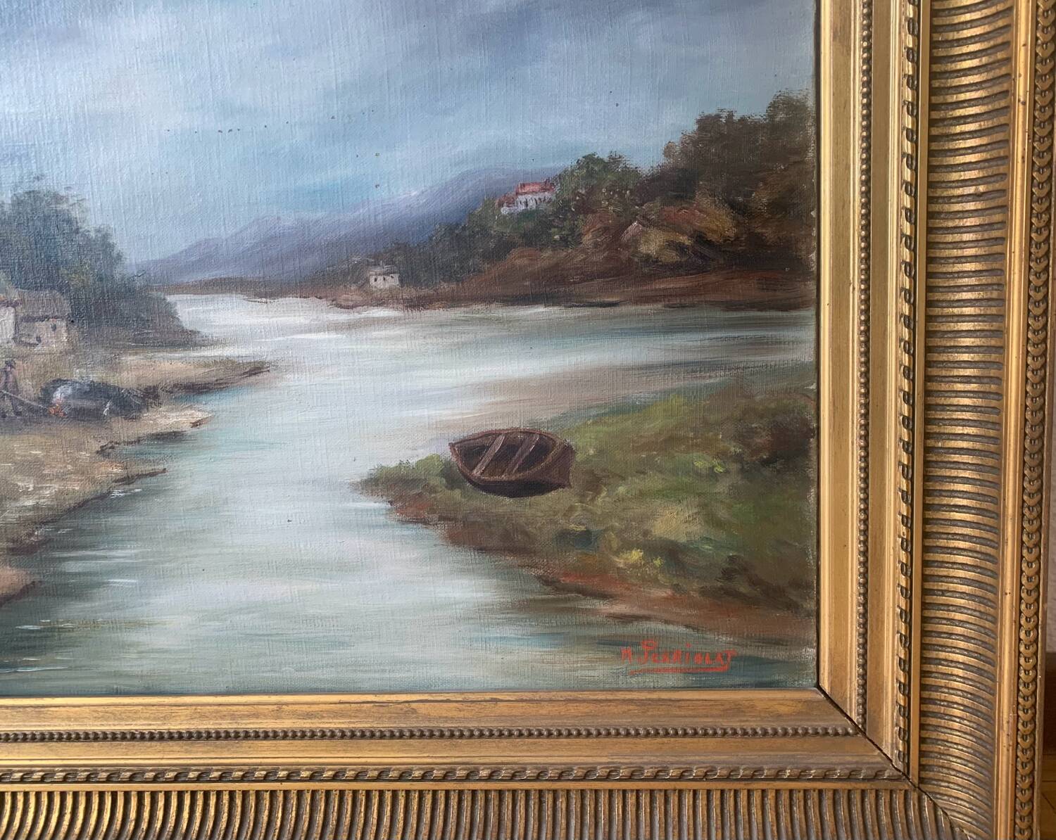 Large painting of a house by the water