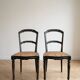 Set of 2 antique chairs in blackened wood and caned.