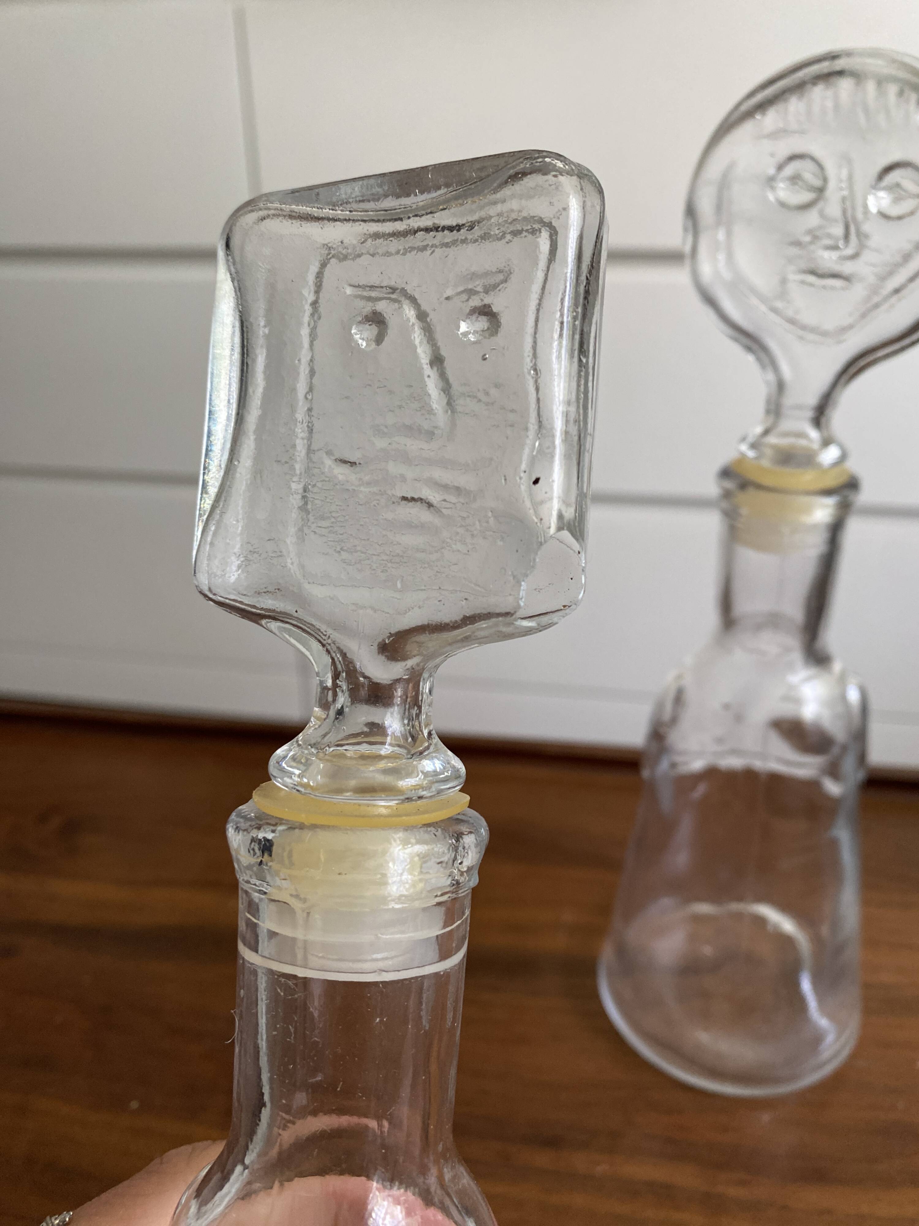 Pair of decanters by Erik Hoglund for Neiman Marcus, "People" series, Kosta Boda