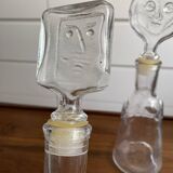 Pair of decanters by Erik Hoglund for Neiman Marcus, "People" series, Kosta Boda