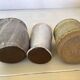 Seven beige and gray ceramic vases