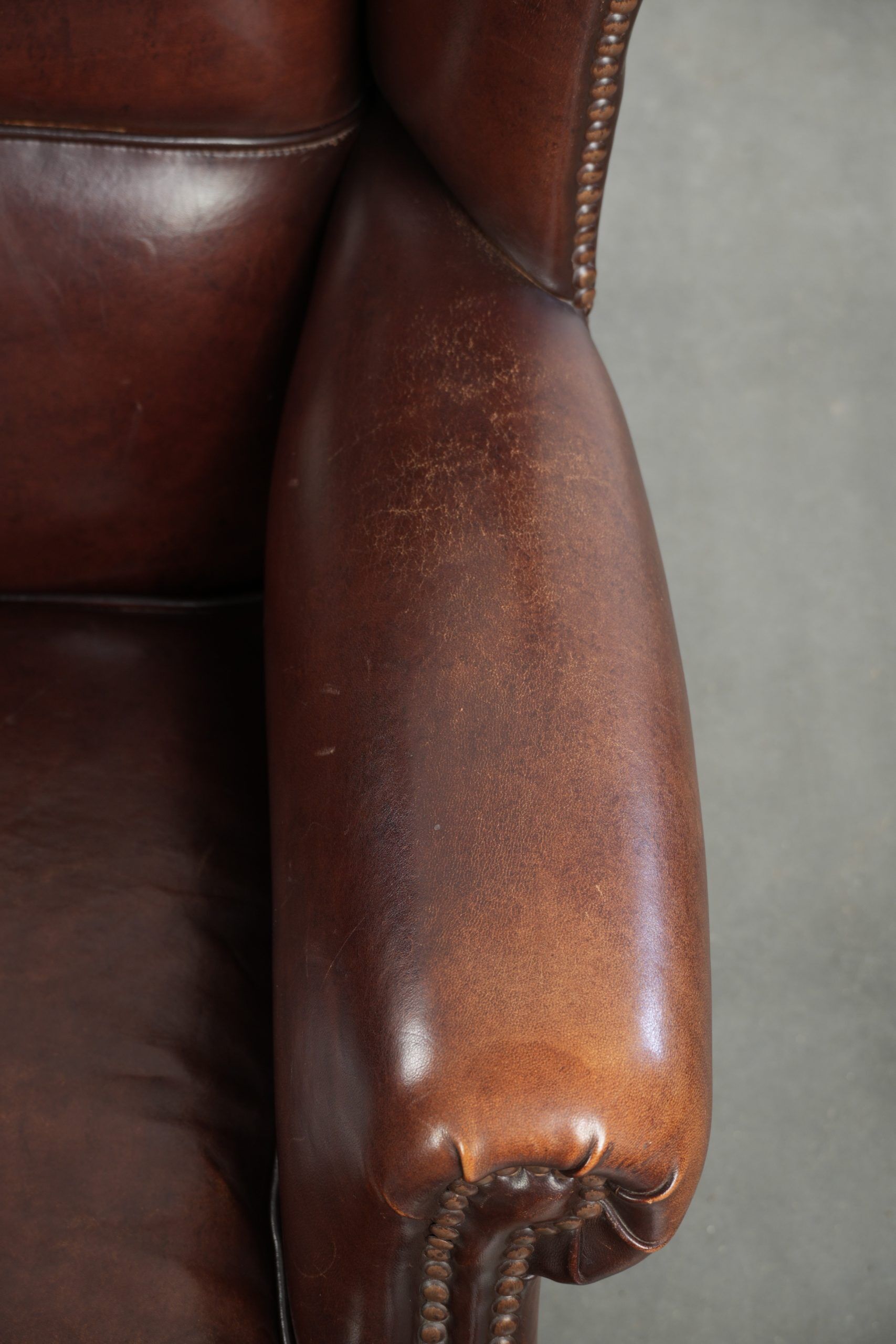 Vintage sheepskin wingback armchair with a timeless English look