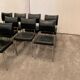 Suite of nine vintage chairs in chrome and imitation leather XX century