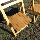 Pair of vintage folding chairs in light wood