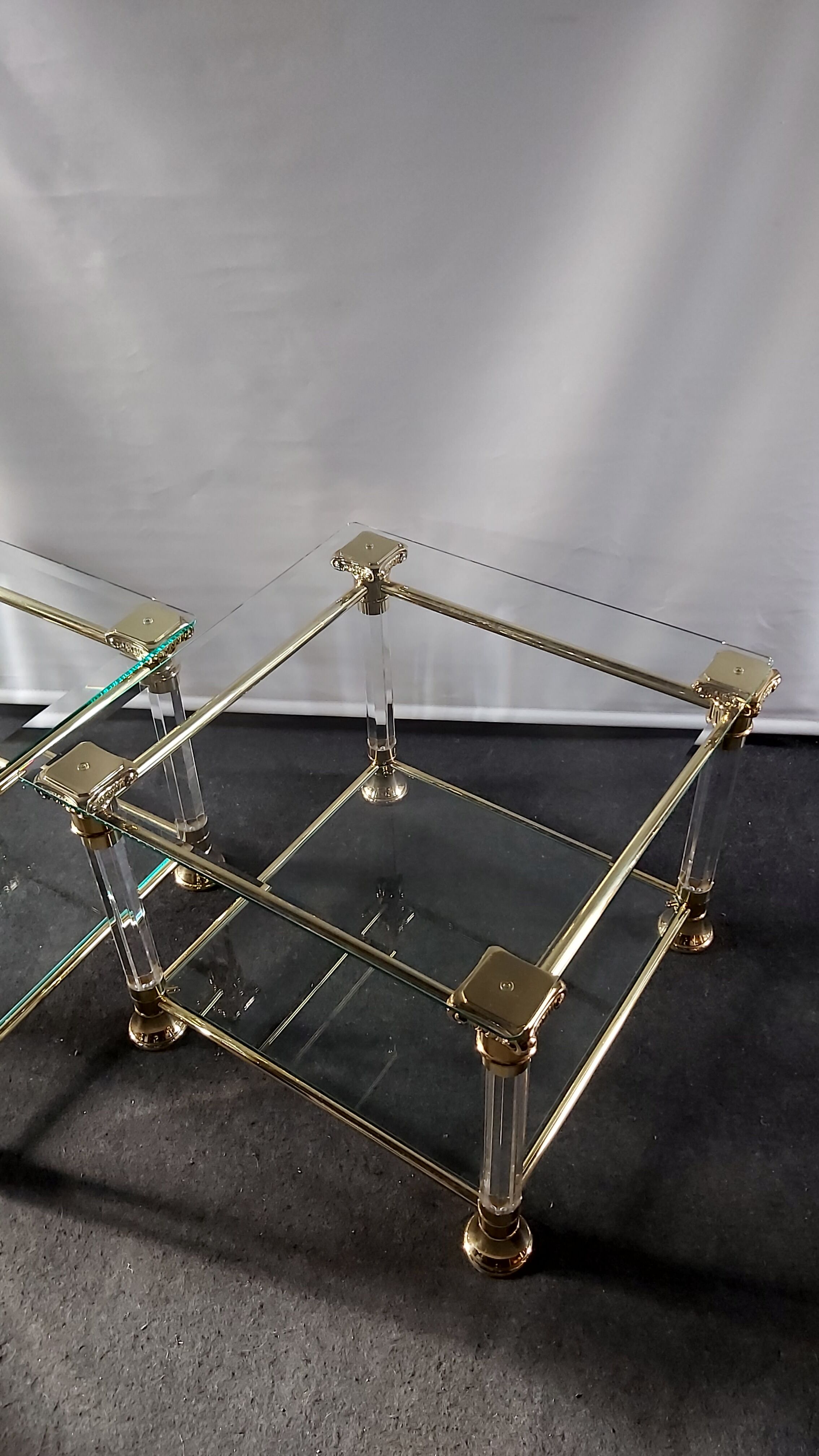 Pair of tables in brass, acrylic and glass