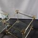 Pair of tables in brass, acrylic and glass