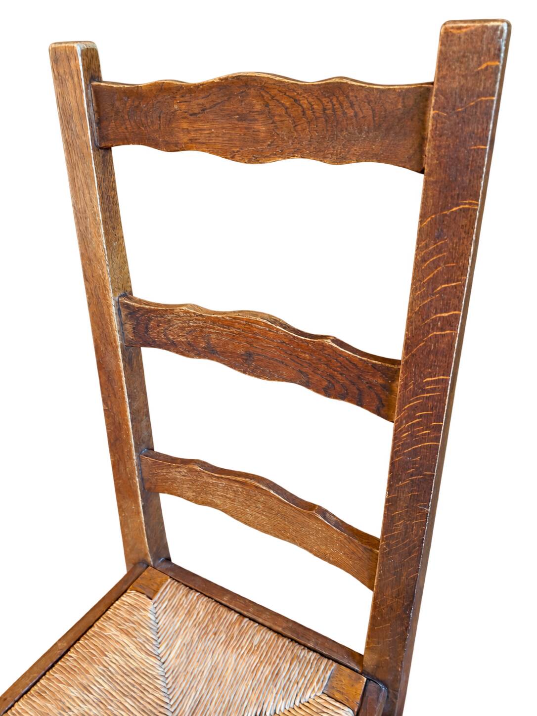 Set of 6 wooden chairs with straw seats and high backs.