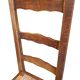 Set of 6 wooden chairs with straw seats and high backs.
