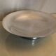 Large flat circular cut on silver metal pedestal