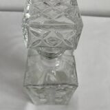 Molded glass carafe, 1960s-1970s, stylized flower decoration, oval, square base, stopper, rosette