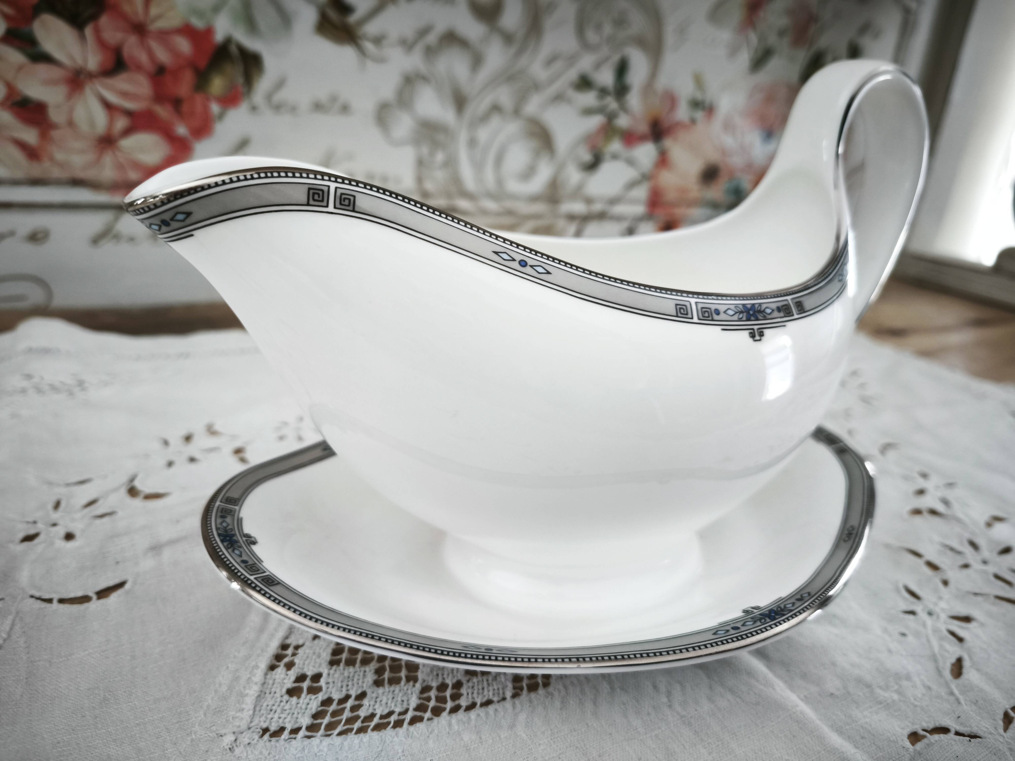 Sauce boat on a porcelain base in English Wedgwood model Amherst.