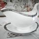 Sauce boat on a porcelain base in English Wedgwood model Amherst.