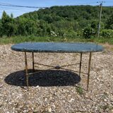 Oval coffee table in veined green marble