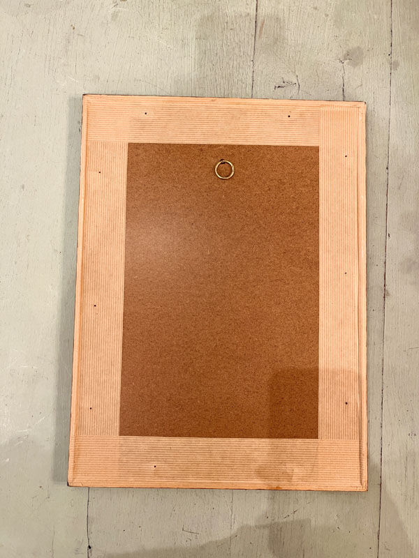 Old board framed under glass, bird