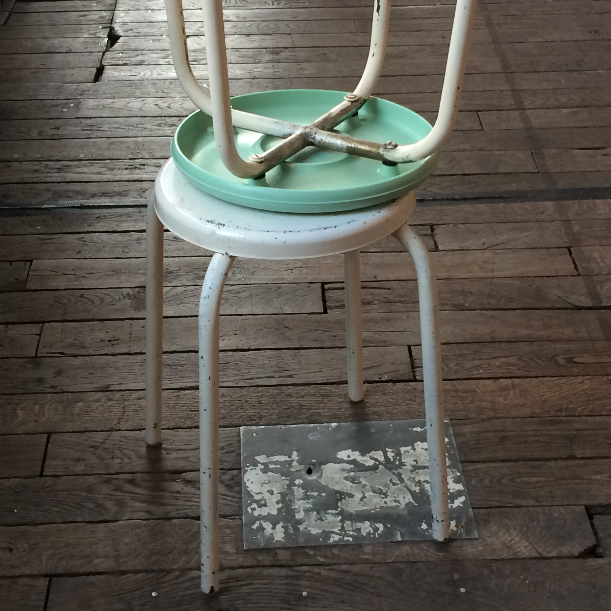 Two white and mint green stools