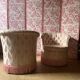 Pair of vintage 1970s cabriolet armchairs in Hollywood Regency style with satin pink upholstery.