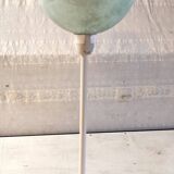Table lamp with a pale green Clichy glass globe.
