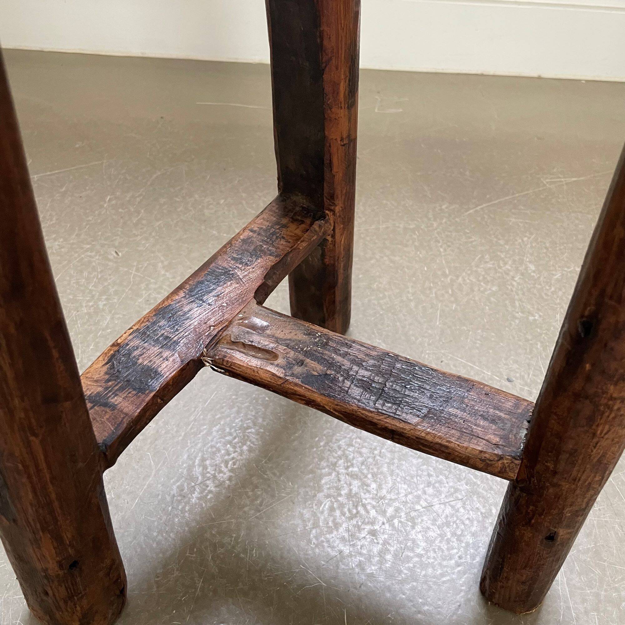 Antique tripod wooden stool, brutalist, wabi sabi style