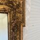 Large mirror from the Napoleonic III era with a floral pediment.