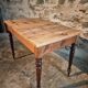 Vintage French pine table with extendable side, circa 1930, suitable for kitchen or office use.