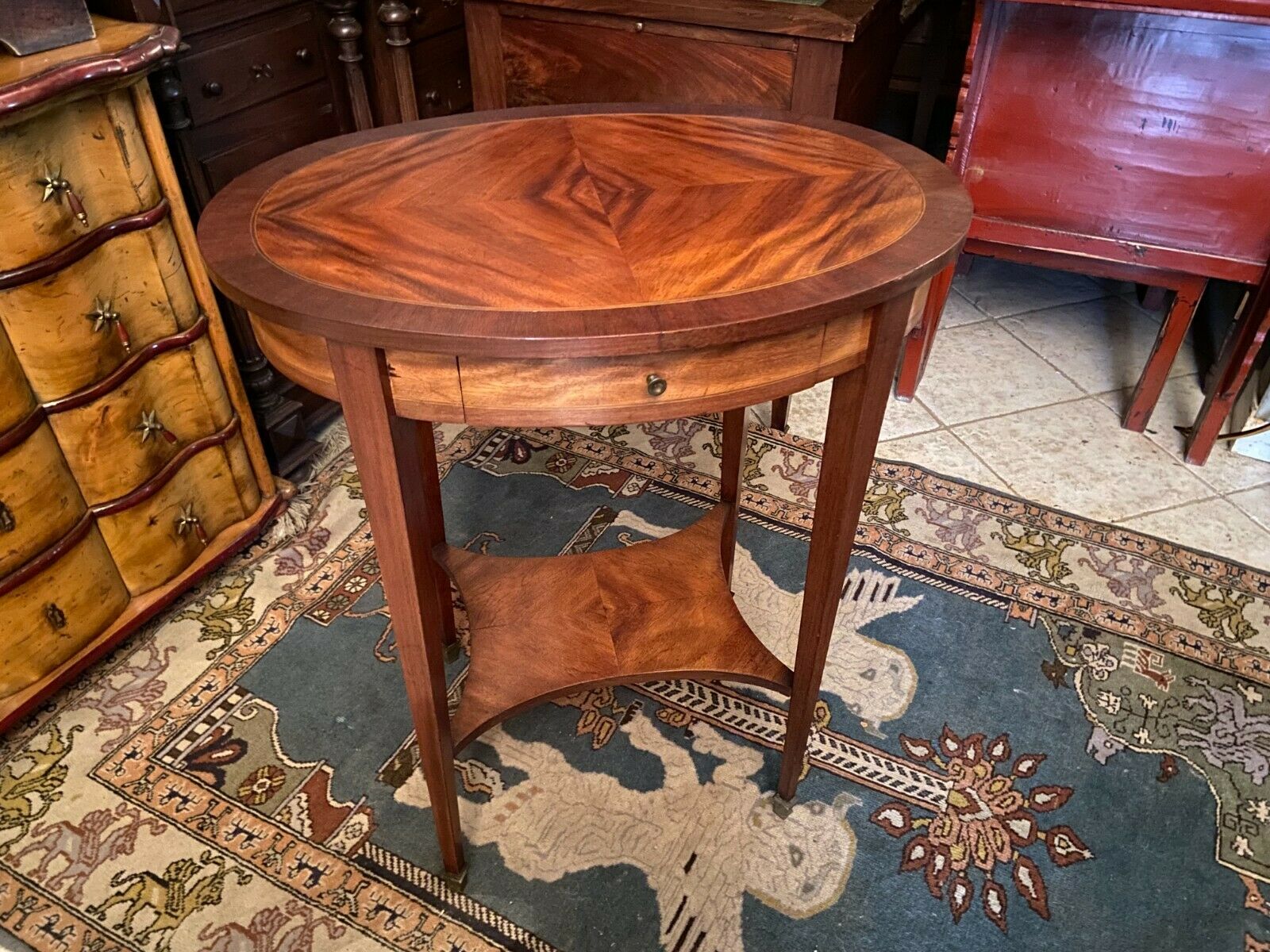 Oval pedestal table with a drawer and a tablet decorated inlaid Louis XVI style